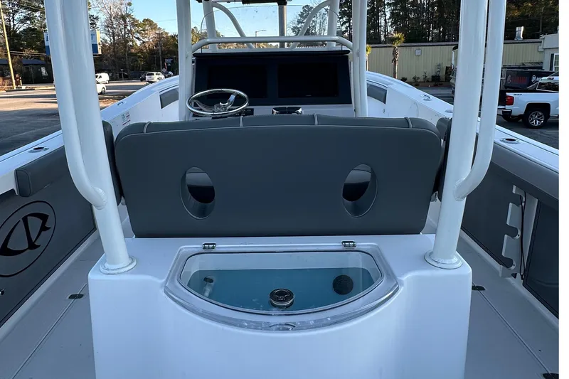 Slide: The Image of 2025 Sea Born SX281 Offshore boat interior with steering console and seating. - 5