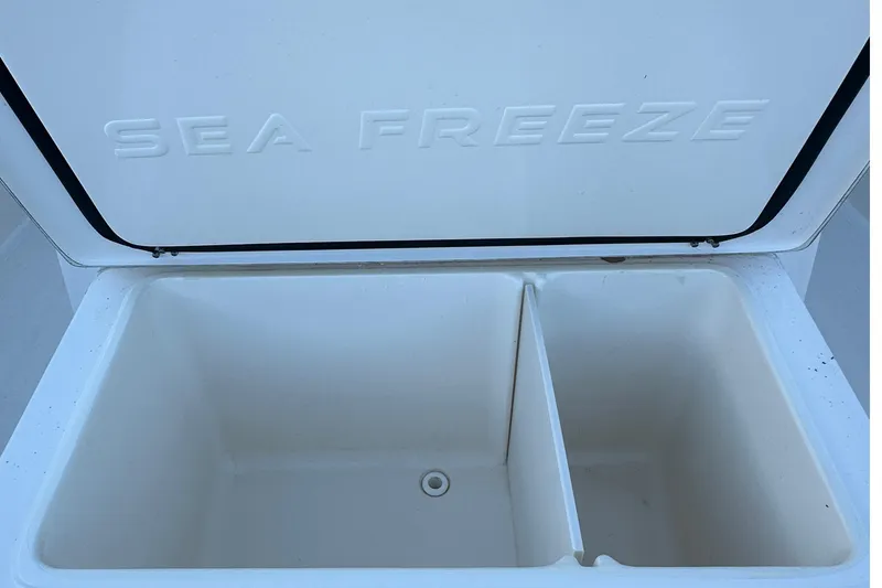 Slide: The Image of Open Sea Freeze compartment on 2025 Sea Born SX281 Offshore boat. - 9