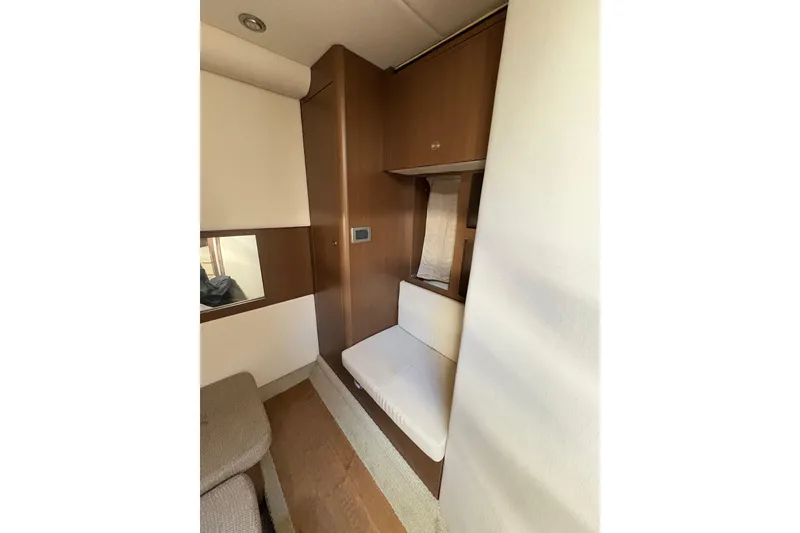 Slide: The Image of Interior of 2018 Sea Ray Sundancer 350 Coupe with wooden cabinetry and seating. - 13