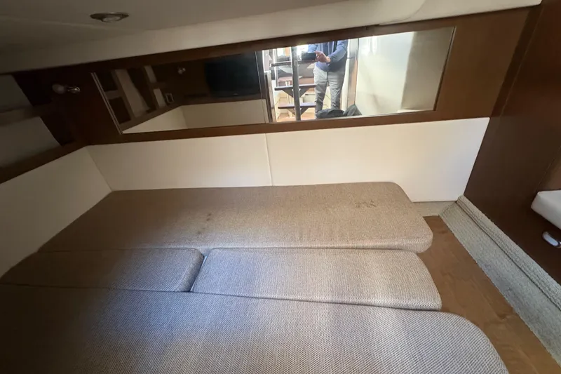 Slide: The Image of Interior cabin of 2018 Sea Ray Sundancer 350 Coupe with cushioned seating. - 14