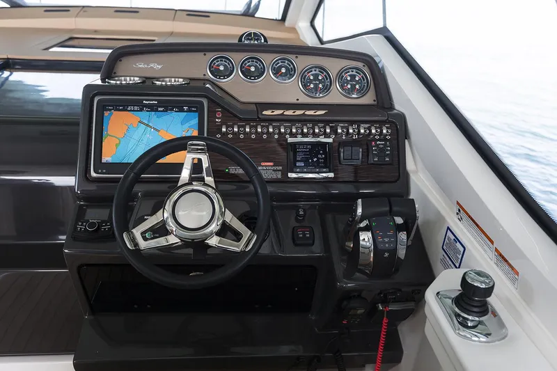 Slide: The Image of Manufacturer Provided Image: 2018 Sea Ray Sundancer 350 Coupe helm with navigation system and controls. - 24