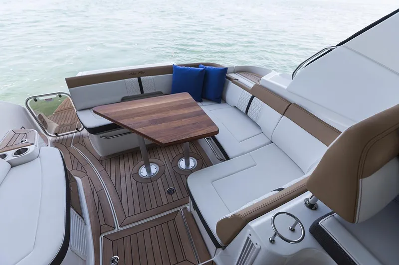 Slide: The Image of Manufacturer Provided Image: 2018 Sea Ray Sundancer 350 Coupe boat interior with seating and wooden table. - 27