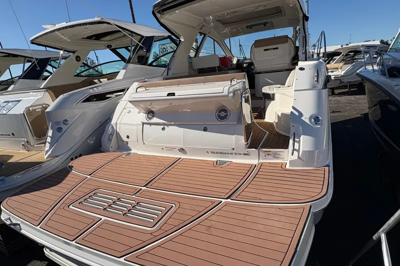 Slide: The Image of 2018 Sea Ray Sundancer 350 Coupe yacht with spacious deck and modern design. - 5
