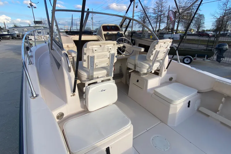 Slide: The Image of 1999 Grady-White Seafarer 228 boat interior with seating and storage compartments. - 11