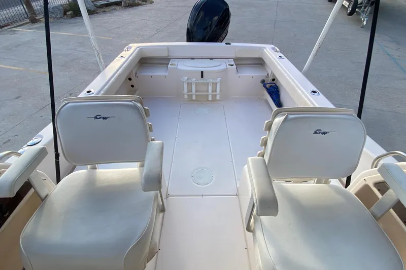 Slide: The Image of 1999 Grady-White Seafarer 228 boat cockpit with steering wheel and controls. - 13