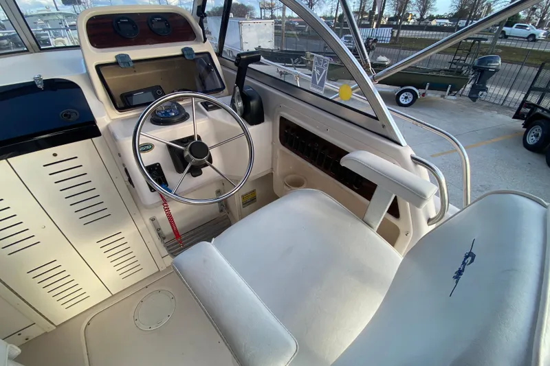 Slide: The Image of Control panel of a 1999 Grady-White Seafarer 228 boat with labeled switches. - 15