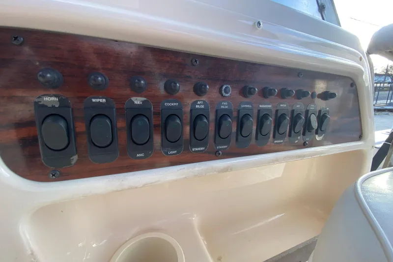 Slide: The Image of Interior cabin of 1999 Grady-White Seafarer 228 boat with seating and windows. - 17