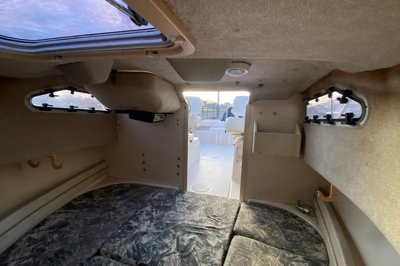 Slide: The Image of 1999 Grady-White Seafarer 228 boat deck with windshield and railing. - 19