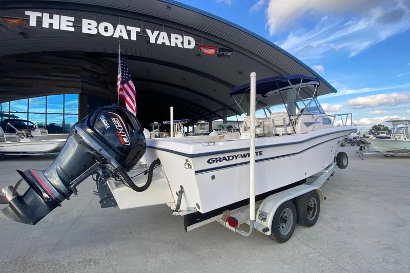 Slide: The Image of 1999 Grady-White Seafarer 228 boat on trailer with Yamaha outboard motor. - 4