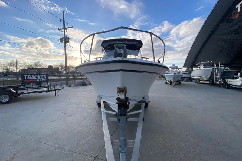 Slide: The Image of 1999 Grady-White Seafarer 228 boat interior with seating and steering wheel. - 9