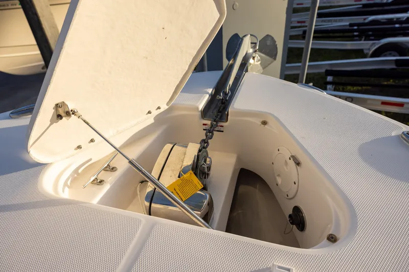 Slide: The Image of 2020 Robalo R302 Center Console anchor compartment with open hatch. - 13