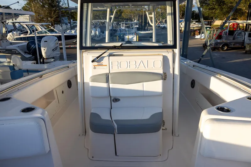 Slide: The Image of 2020 Robalo R302 Center Console boat interior with seating and console view. - 14
