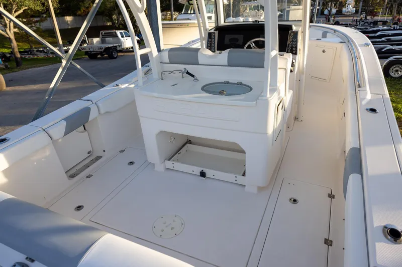 Slide: The Image of 2020 Robalo R302 Center Console boat interior with seating and console features. - 4