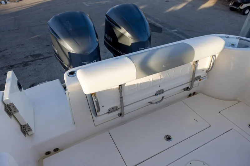 Slide: The Image of 2020 Robalo R302 Center Console boat with dual Yamaha engines, rear seating view. - 5