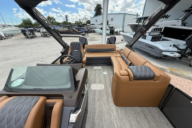 Slide: The Image of 2026 Bennington 27 QSBAT2 luxury boat interior with plush seating and modern design. - 12