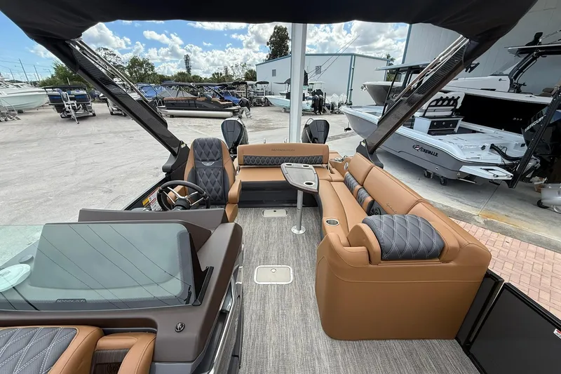 Slide: The Image of 2026 Bennington 27 QSBAT2 pontoon boat interior with luxurious seating and modern design. - 13