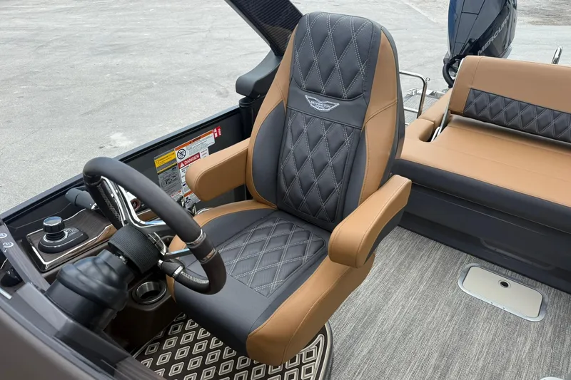 Slide: The Image of 2026 Bennington 27 QSBAT2 boat interior with luxury seating and steering wheel. - 14