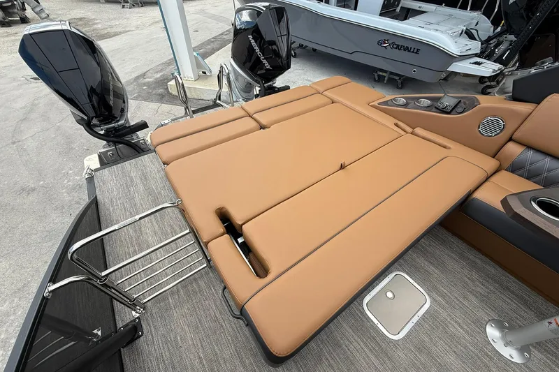 Slide: The Image of 2026 Bennington 27 QSBAT2 boat with tan seating and dual Mercury outboard engines. - 21