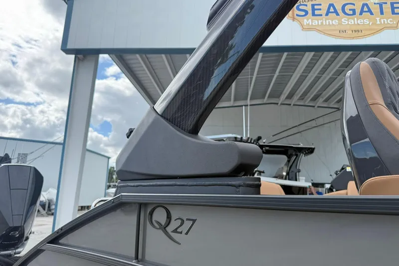 Slide: The Image of 2026 Bennington 27 QSBAT2 boat at Seagate Marine Sales, featuring sleek design elements. - 4