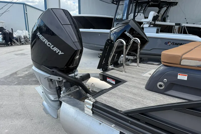Slide: The Image of 2026 Bennington 27 QSBAT2 boat with dual Mercury outboard engines. - 5