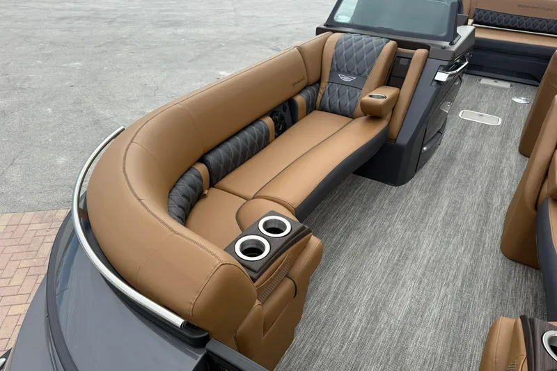 Slide: The Image of Luxurious interior of 2026 Bennington 27 QSBAT2 pontoon boat with tan seating. - 9