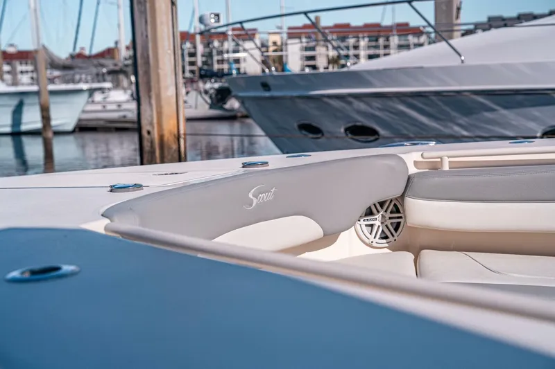 Slide: The Image of 2020 Scout 380 LXF boat interior with luxury seating at marina. - 13
