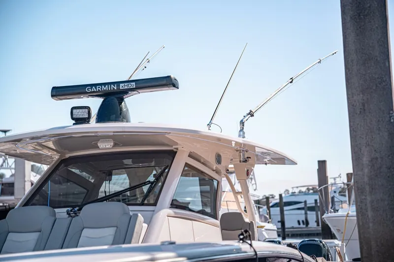 Slide: The Image of 2020 Scout 380 LXF boat with Garmin radar, docked at marina. - 15
