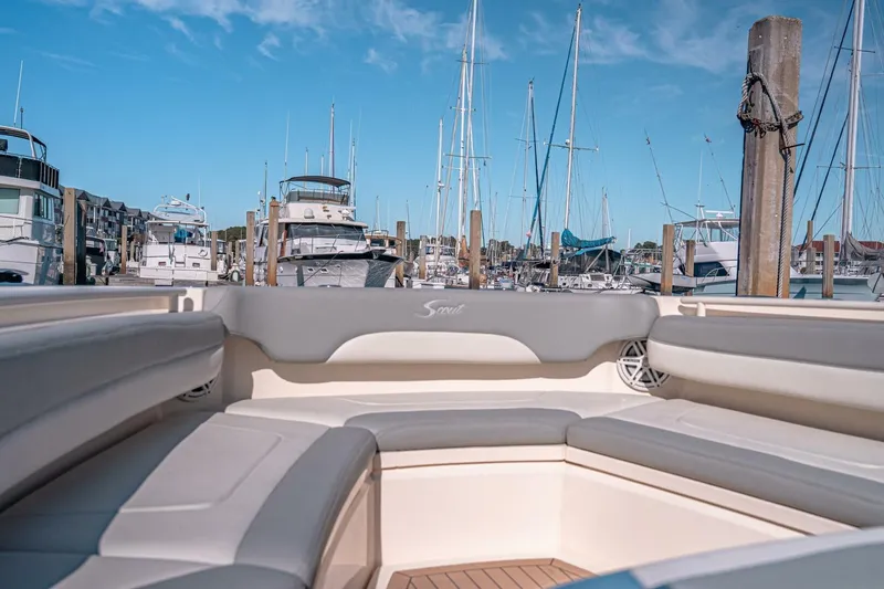 Slide: The Image of 2020 Scout 380 LXF boat interior at marina with yachts and clear blue sky. - 28