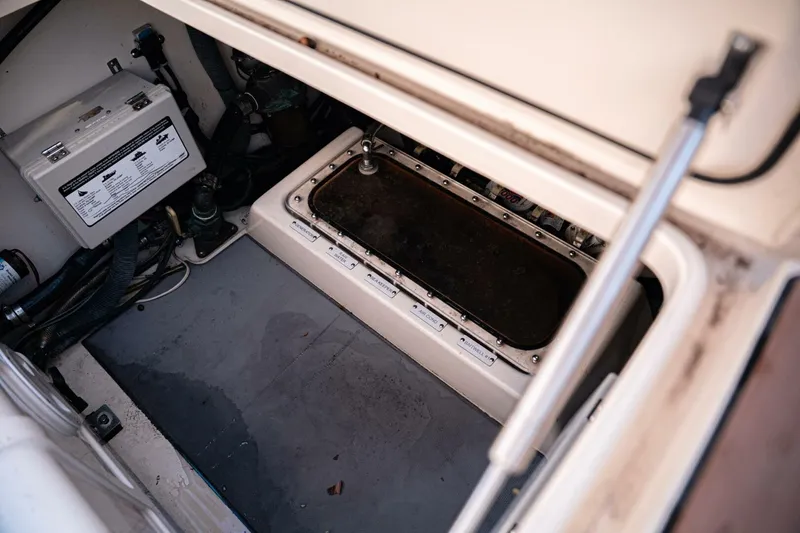 Slide: The Image of 2020 Scout 380 LXF boat compartment with electrical components and wiring. - 33
