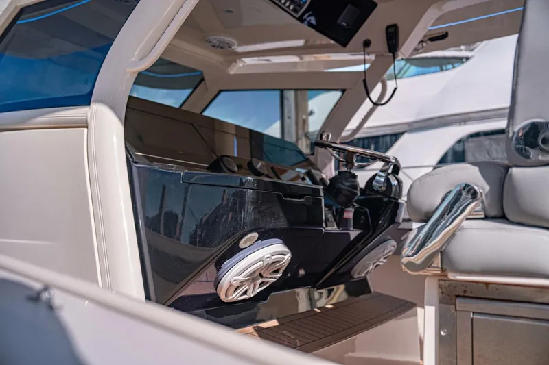 Slide: The Image of 2020 Scout 380 LXF boat interior with modern helm and luxurious seating. - 6