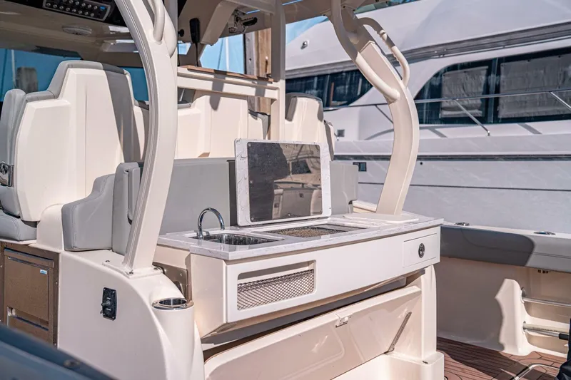 Slide: The Image of 2020 Scout 380 LXF boat interior with sink and seating area. - 9