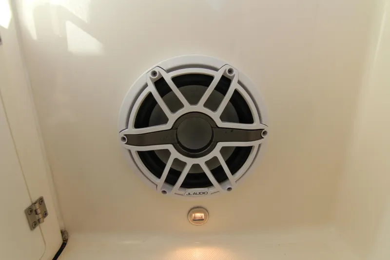 Slide: The Image of Speaker system on 2023 Pursuit DC 295 Dual Console boat interior. - 18