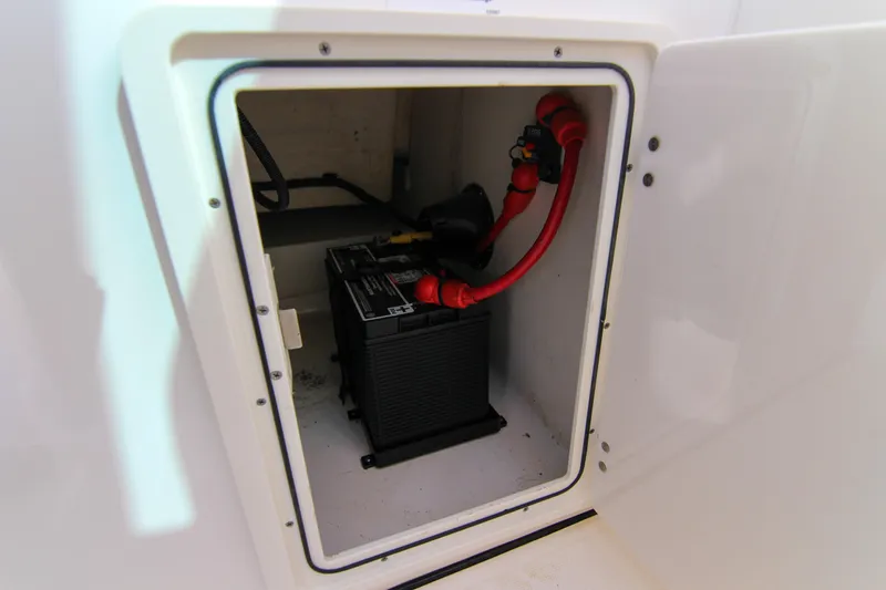 Slide: The Image of Battery compartment of 2023 Pursuit DC 295 Dual Console boat. - 19