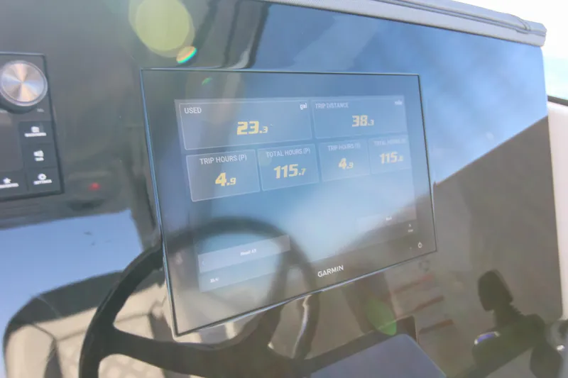 Slide: The Image of Dashboard of 2023 Pursuit DC 295 Dual Console with Garmin display showing trip data. - 24