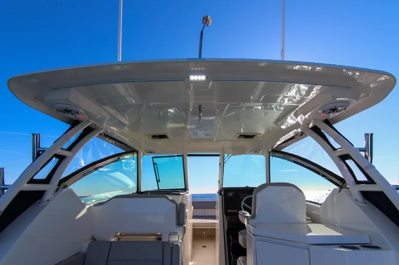 Slide: The Image of 2023 Pursuit DC 295 Dual Console boat interior with sleek design and ocean view. - 27