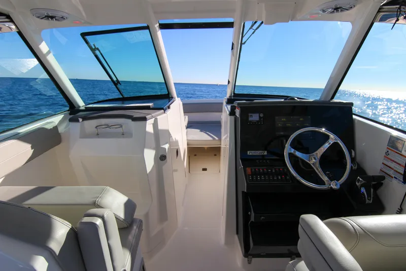 Slide: The Image of 2023 Pursuit DC 295 Dual Console boat interior with ocean view. - 33
