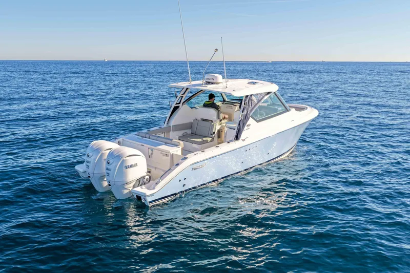 Slide: The Image of 2023 Pursuit DC 295 Dual Console boat cruising on open water. - 37