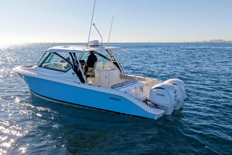 Slide: The Image of 2023 Pursuit DC 295 Dual Console boat cruising on open water. - 46