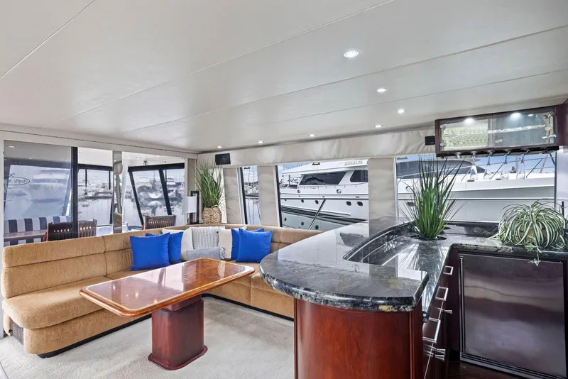 Slide: The Image of Luxurious interior of a 1998 Pacific Mariner 65 yacht with elegant seating and modern decor. - 10
