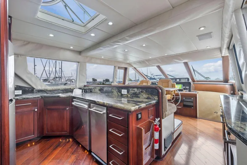 Slide: The Image of Luxurious interior of a 1998 Pacific Mariner 65 yacht with modern kitchen and helm. - 16
