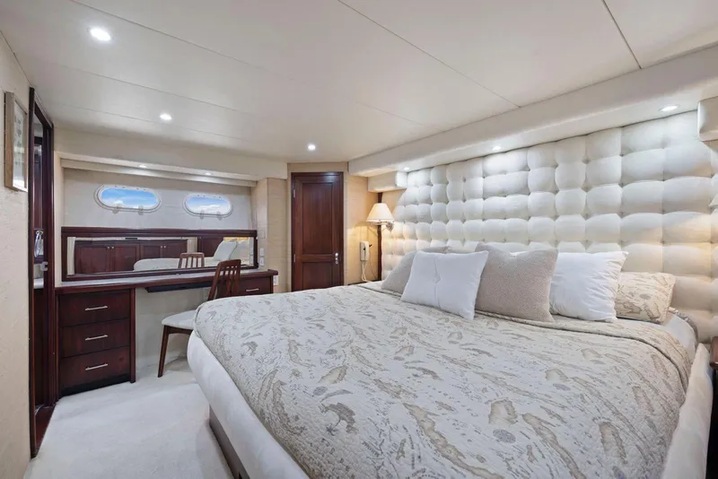 Slide: The Image of Luxurious bedroom interior of 1998 Pacific Mariner 65 yacht with elegant decor and plush bedding. - 33