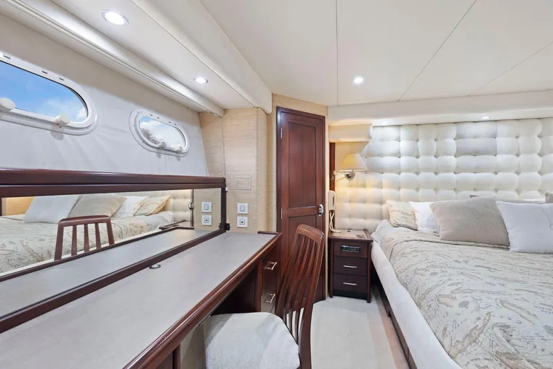 Slide: The Image of Luxurious 1998 Pacific Mariner 65 yacht bedroom with elegant decor and plush bedding. - 36