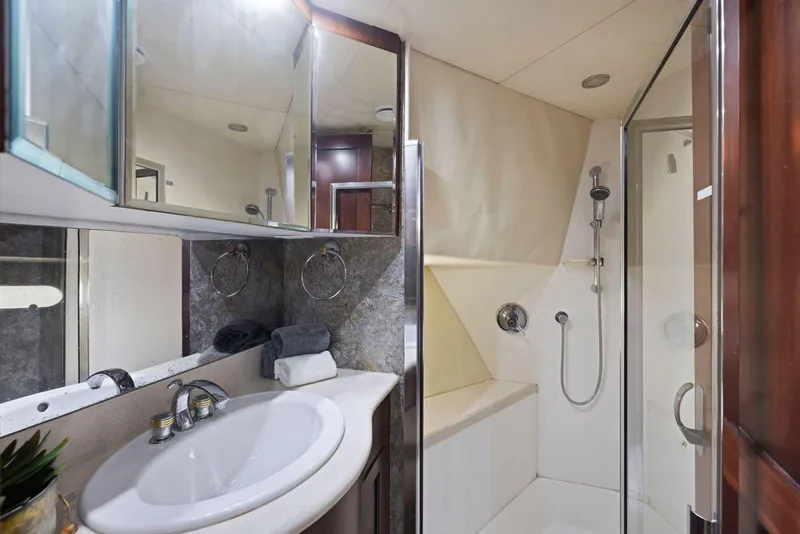 Slide: The Image of Luxurious bathroom in 1998 Pacific Mariner 65 yacht with shower and vanity. - 41