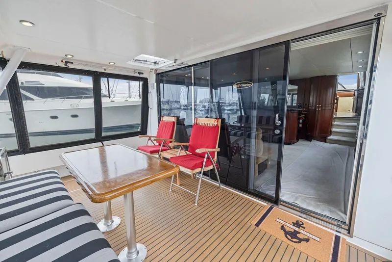 Slide: The Image of Luxurious 1998 Pacific Mariner 65 yacht interior with seating and table on deck. - 5