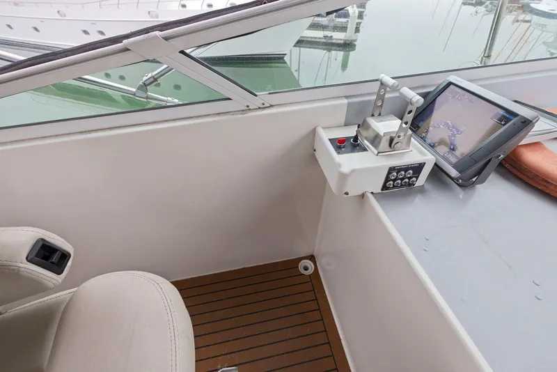Slide: The Image of Control panel and navigation screen on a 1998 Pacific Mariner 65 yacht. - 50