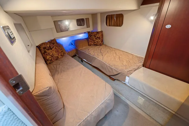 Slide: The Image of 2005 Sea Ray 420 Sedan Bridge cabin with twin beds and elegant decor. - 15
