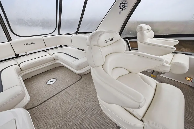 Slide: The Image of Luxurious interior of 2005 Sea Ray 420 Sedan Bridge with plush white seating. - 20
