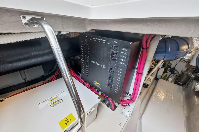 Slide: The Image of Engine room of 2005 Sea Ray 420 Sedan Bridge with electrical panel and wiring. - 22