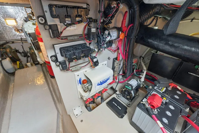 Slide: The Image of Engine room of 2005 Sea Ray 420 Sedan Bridge with electrical components and wiring. - 24