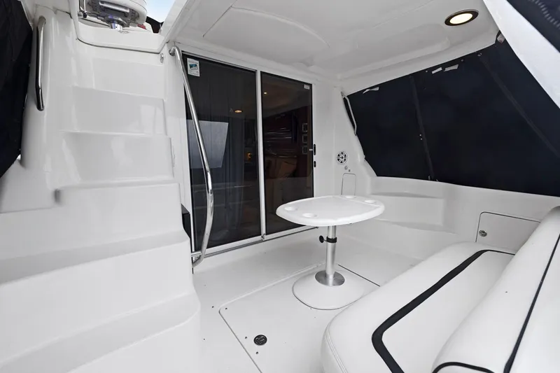 Slide: The Image of 2005 Sea Ray 420 Sedan Bridge yacht interior with seating and table. - 3